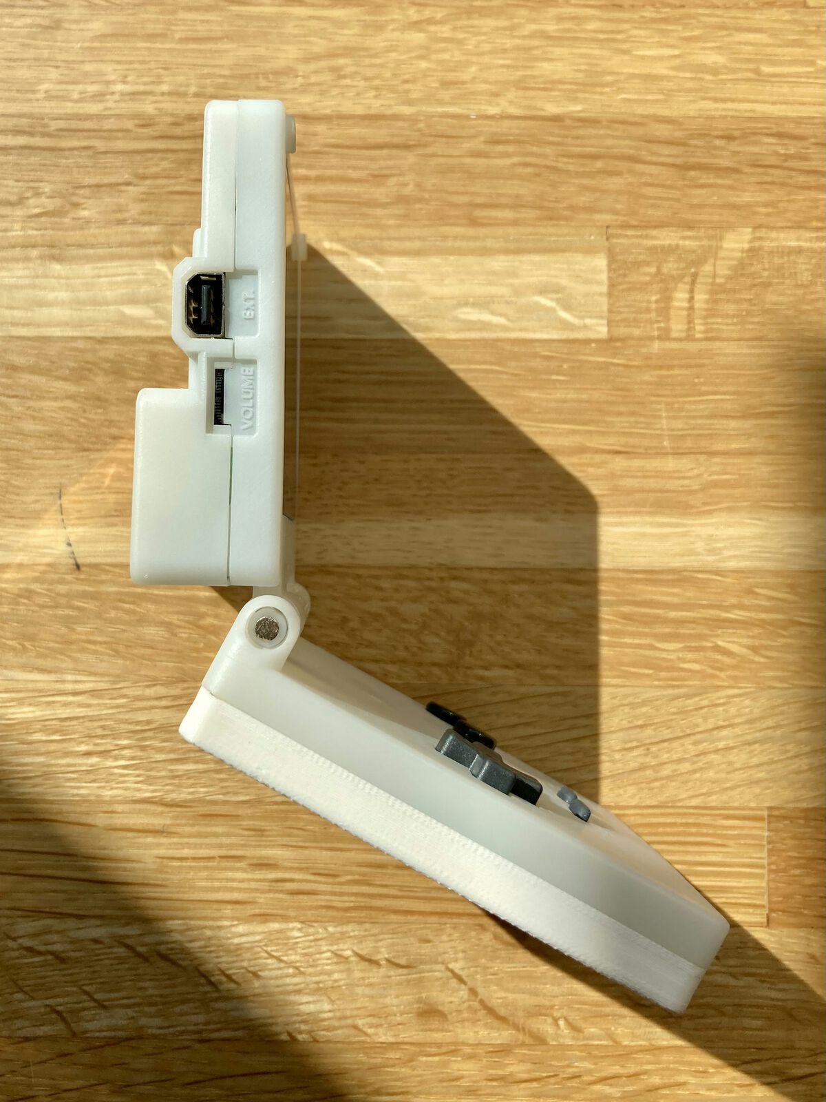 Profile of the Pocket SP, where the bottom outside is cream-colored FDM ABS, and the other parts are semi-translucent white resin